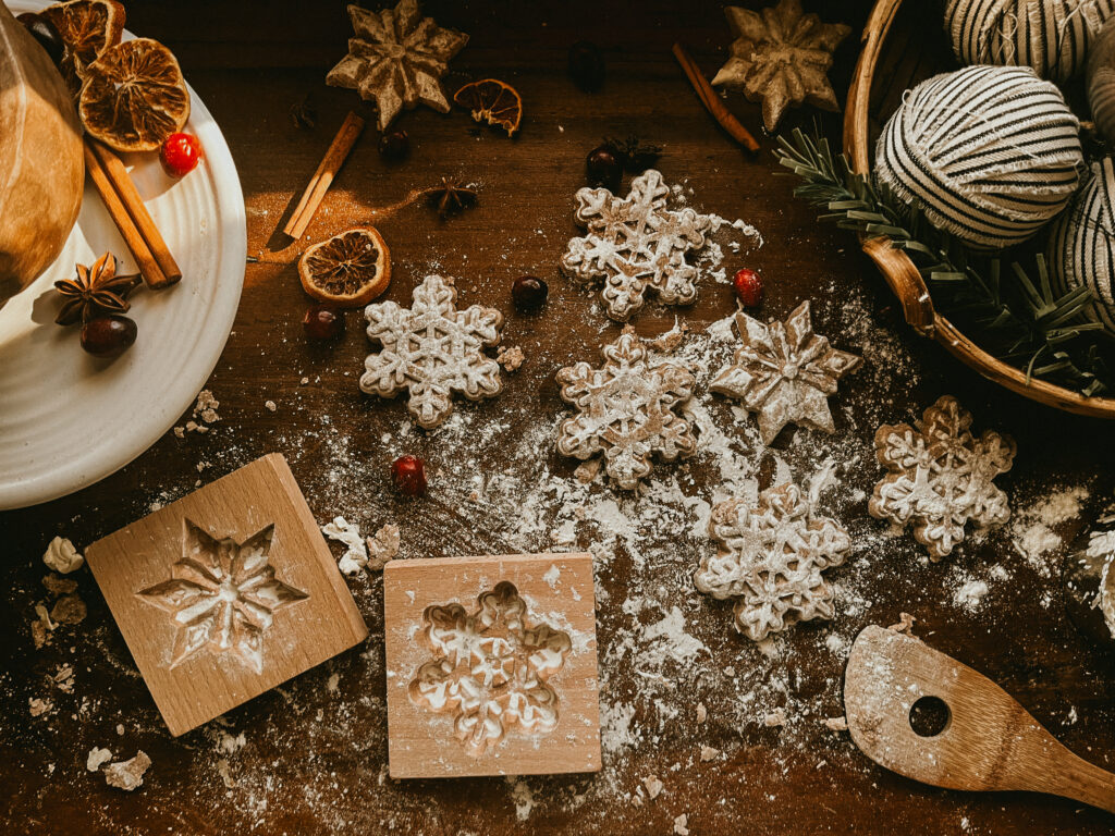 Salt dough ornaments with vintage designs made using a wooden cookie press