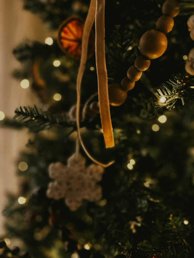 Finished vintage-style salt dough ornaments tied with ribbon
